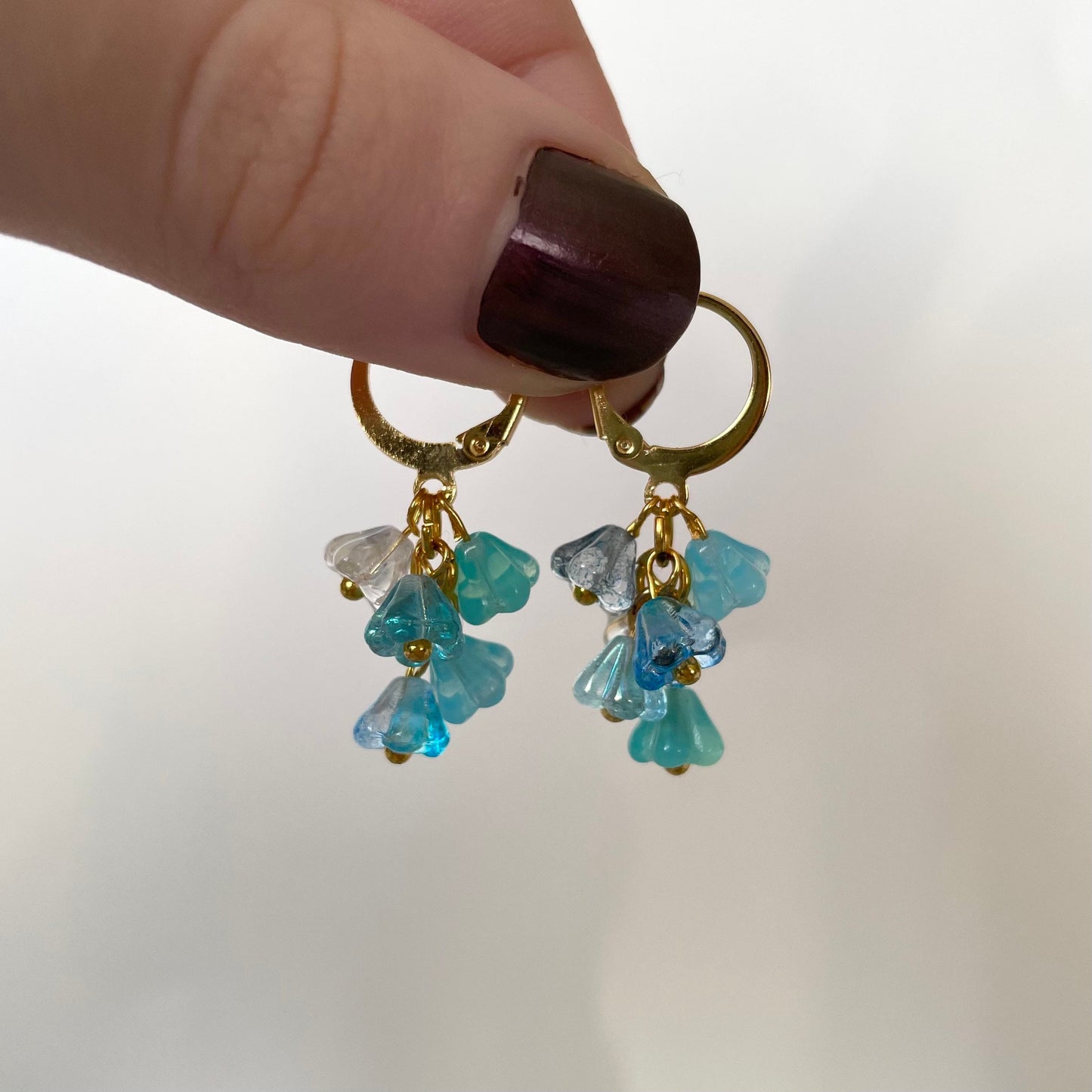 Dainty blue flower bunch huggie hoop earrings