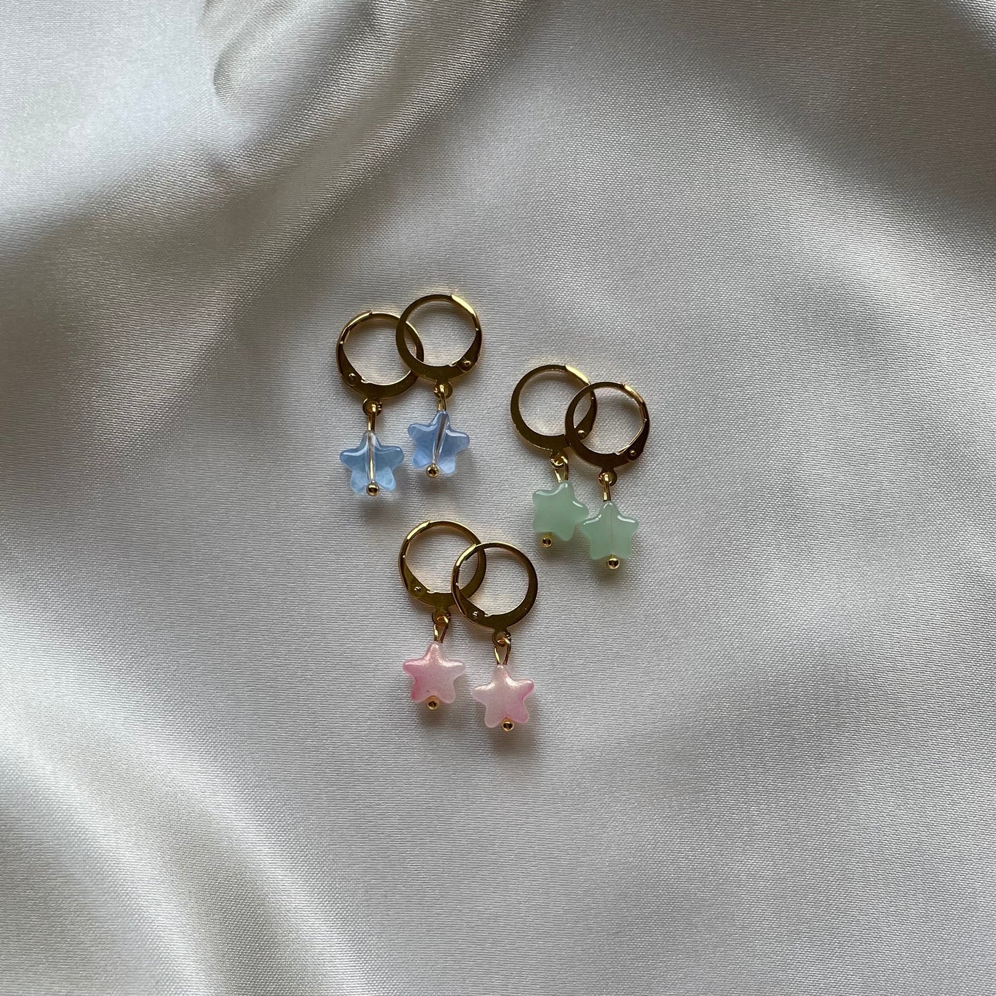 Star huggie hoop earrings