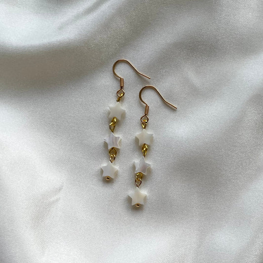 Long pearlescent shell star huggie hoop earrings